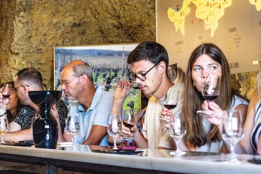 Amboise: Caves Ambacia Visit and Wine Tasting - Buying bottles and staying for lunch