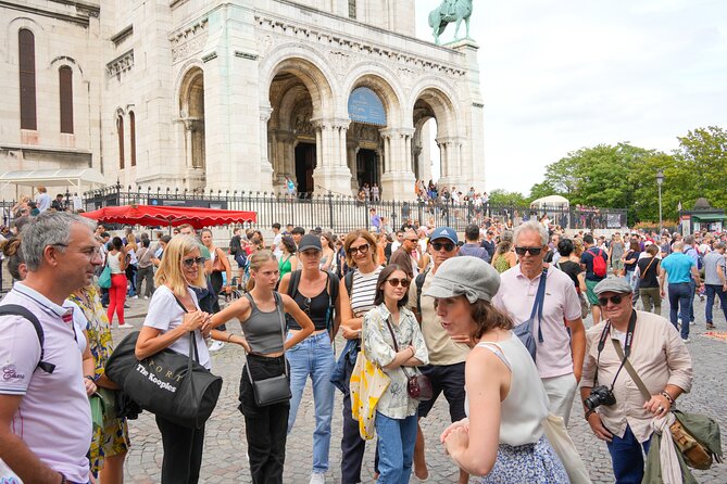Guided tour of Montmartre in songs with a professional - Rue Norvins, Place du Tertre, and Saint-Pierre