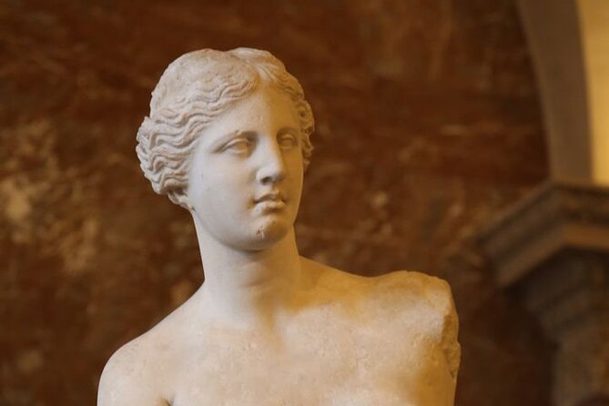 Guided tour of the Louvre Museum with tickets included - Meeting Matteo at Café Marly