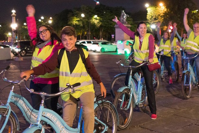 Paris Evening Bike Tour with 1-hour Seine River Cruise - The Louvre courtyard by bicycle