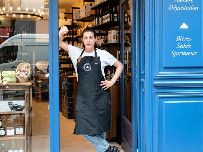 Paris: Gourmet Food Tour with Over 10 Tastings and Wine - Sitting down for cheese, charcuterie, and two wines