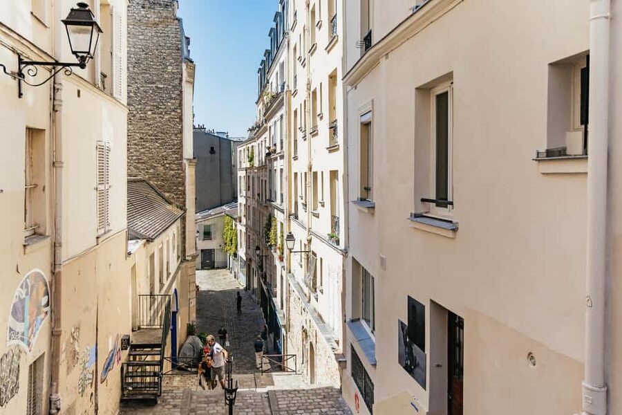 Paris: Hidden Gems of Montmartre with Local Guide - Moulin de la Galette and the village atmosphere