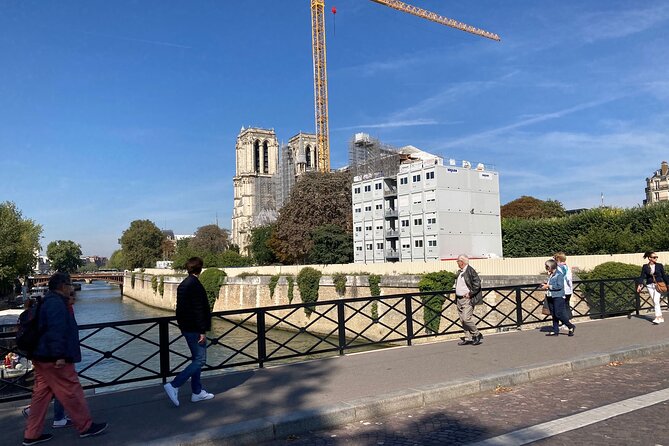 Paris: Île de la Cité and Notre-Dame Walking Tour With Crypt - The Tour de l’Horloge and Paris’s oldest clock