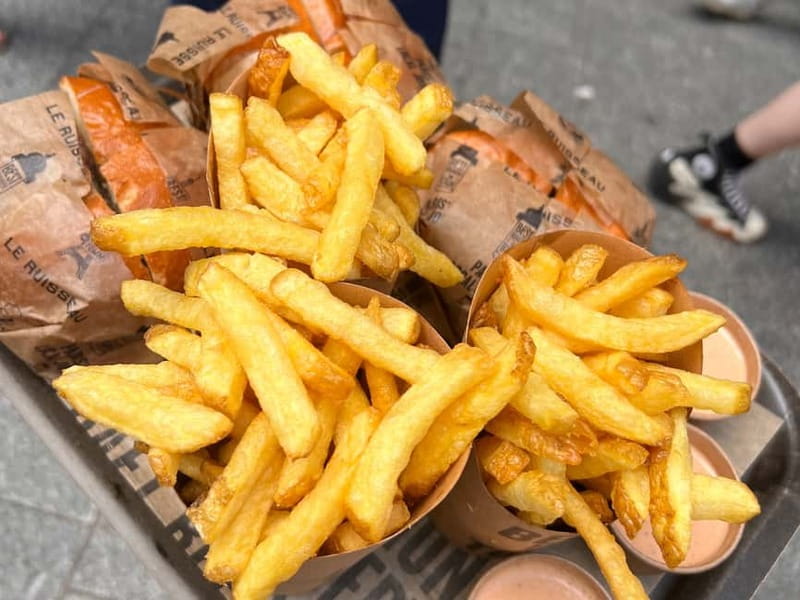 Paris: Le Marais Guided Food Tour with Tastings - Walking through Le Marais between bites