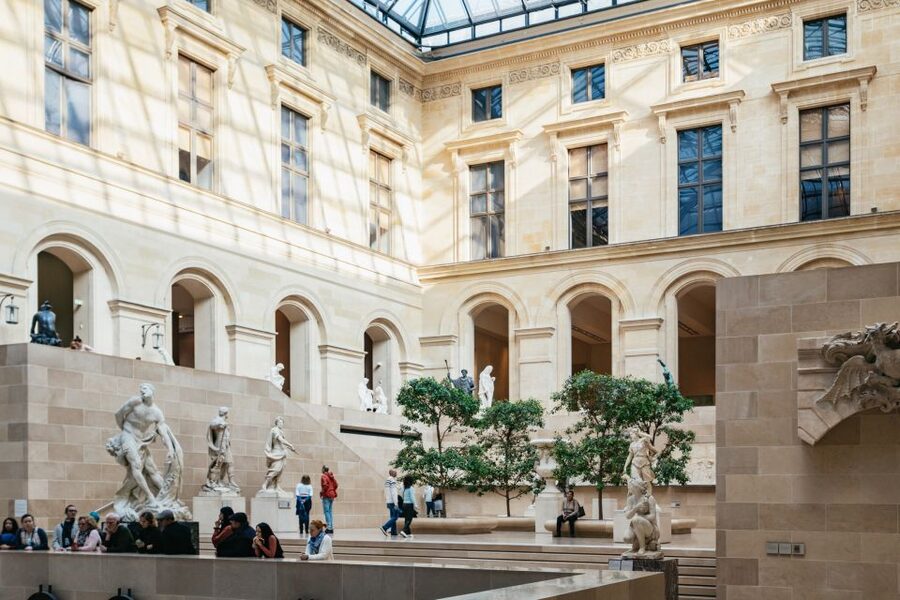 Paris: Louvre Museum Entry Ticket With Host and River Cruise - Making sense of the Louvre’s three wings