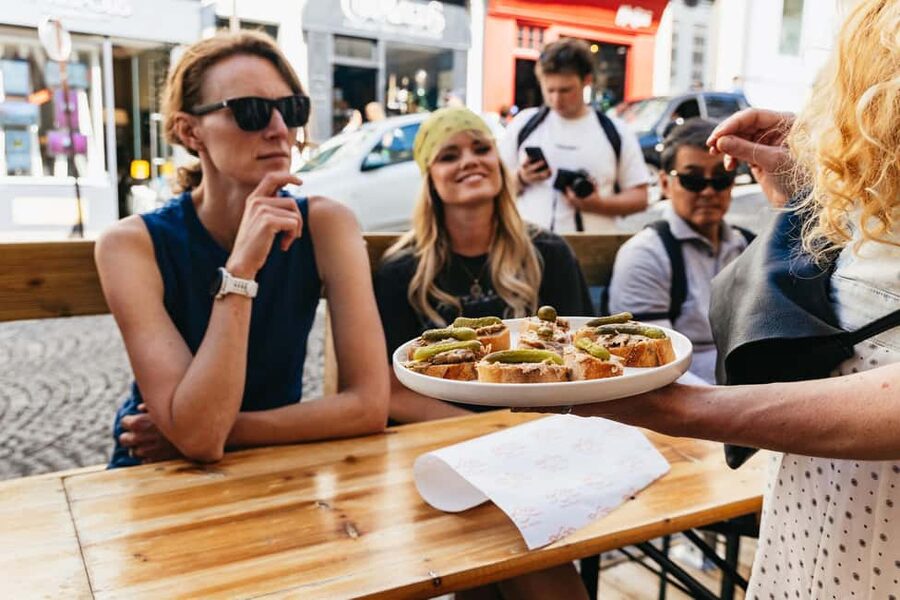 Paris: Montmartre Cheese, Wine & Pastry Guided Walking Tour - Place du Tertre, artists, and the village feeling