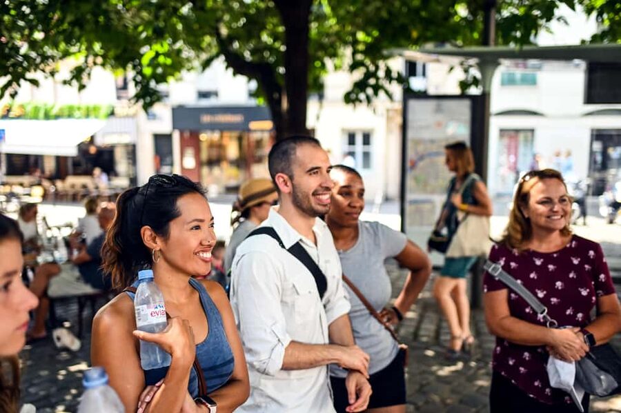 Paris: Montmartre Food Tasting Walking Tour with Secret Dish - The butcher, cured meats, and a very full final course