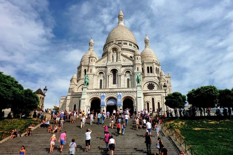 Paris: Montmartre Hidden Gems and Highlights Walking Tour - Moulin de la Galette and Montmartre’s artist past