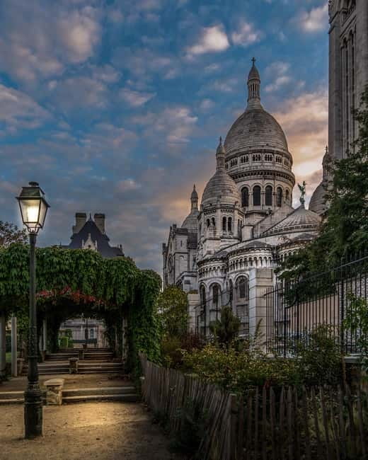 Paris: Montmartre Highlights Walking Tour with a Local Guide - Starting beneath Sacré-Cœur at Place Saint-Pierre
