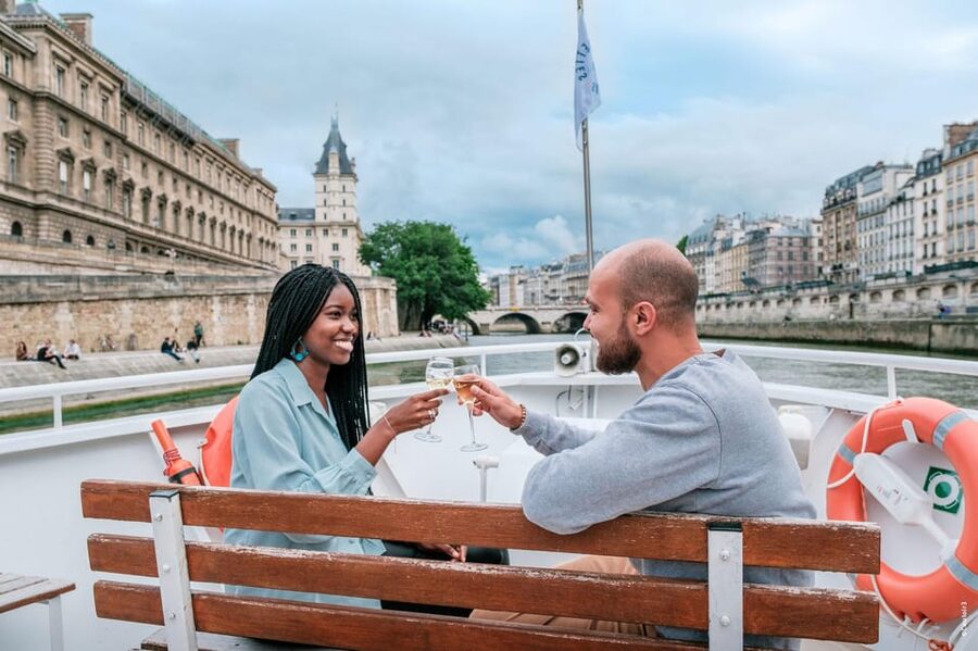 Paris: Seine River Cruise with Champagne from Eiffel Tower - Passing beneath Paris bridges