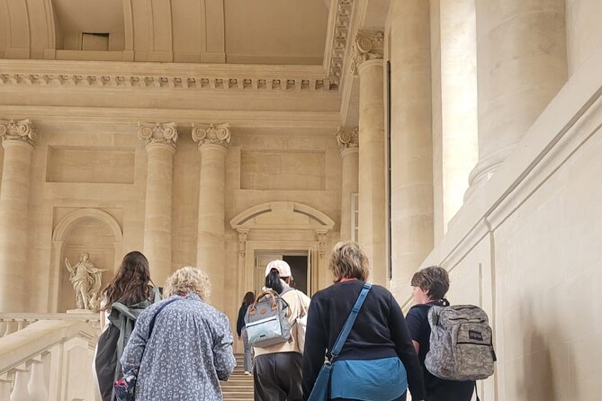 Versailles Palace Guided Tour with Gardens Access - Reaching the Louis XIV statue meeting point